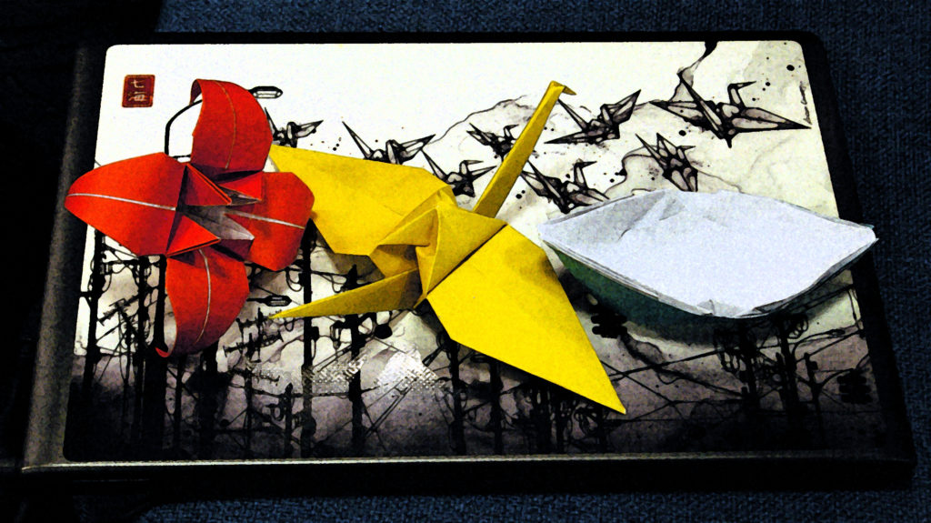 origami cranes on a laptop